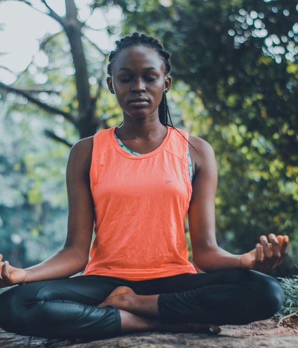 Woman in a peaceful yoga pose, representing inner harmony and calm.